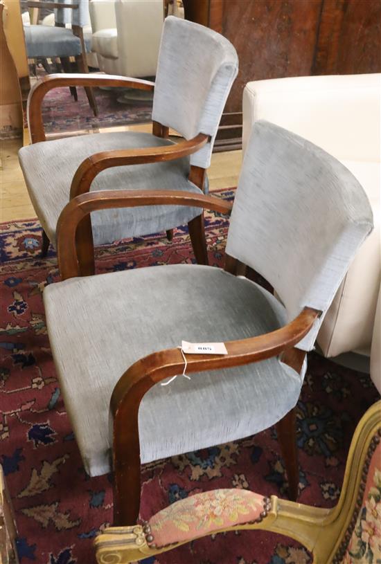 A pair of French Art Deco style beech elbow chairs